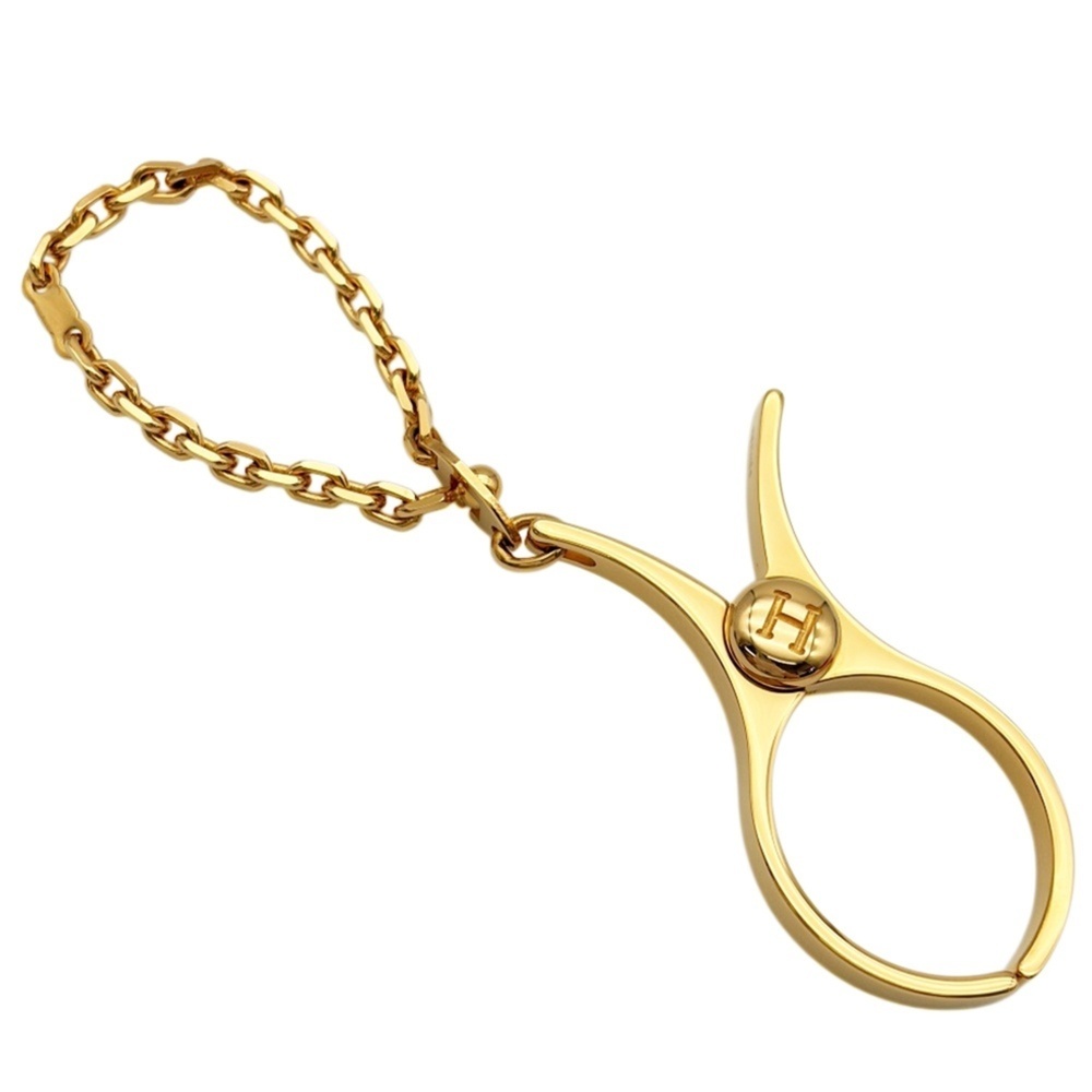 Hermes bag charm clip, Philou glove holder, gold metal.